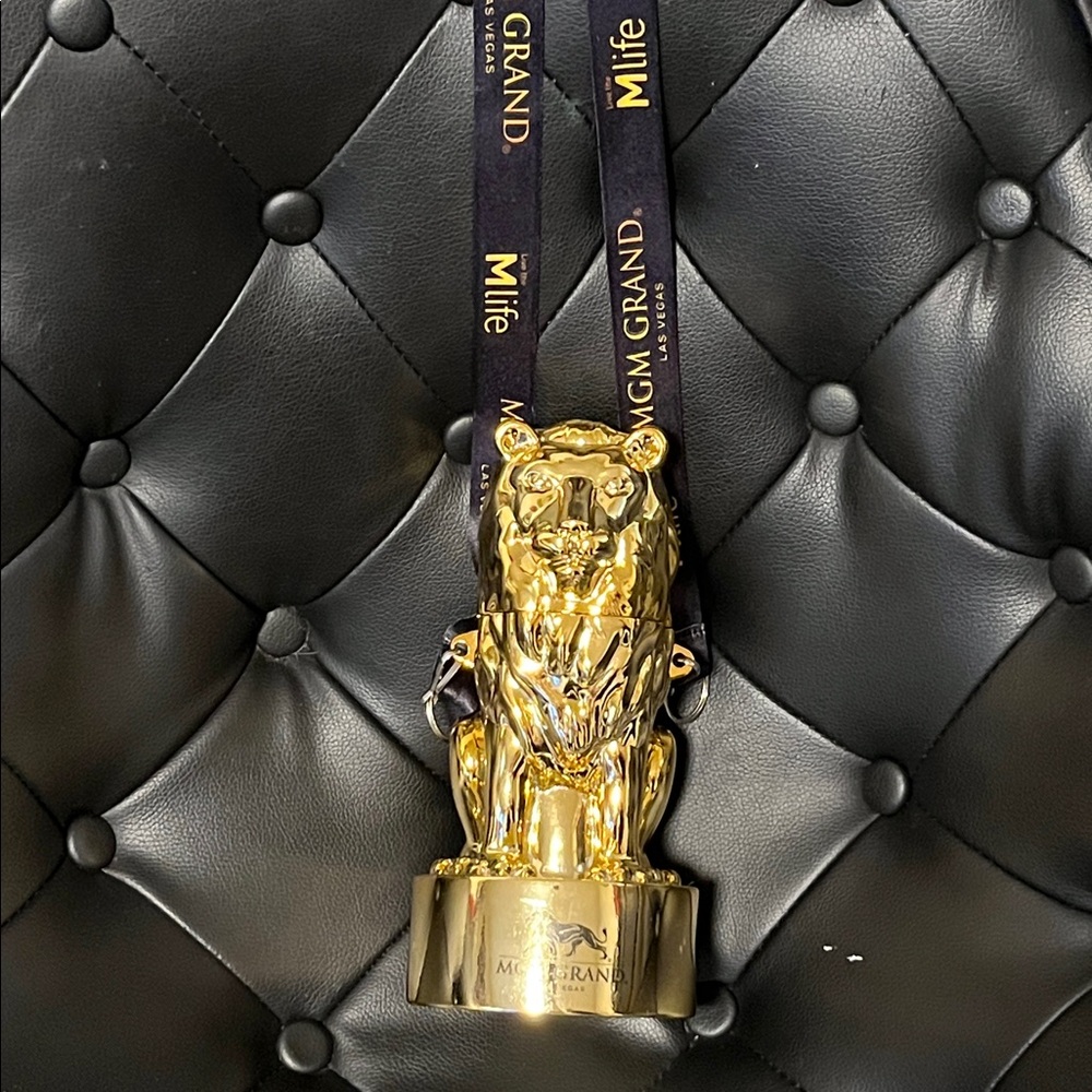 MGM Grand Las Vegas gold Lion drink souvenir cup with strap 9 inch plastic